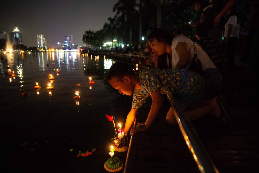 Boy Puts Down Loy Krathong Offering