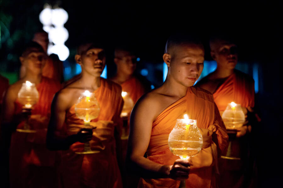 Buddhist Monks Hold Light