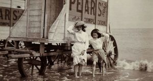 Girls Paddling Beside Bathing Machines, C 1900.