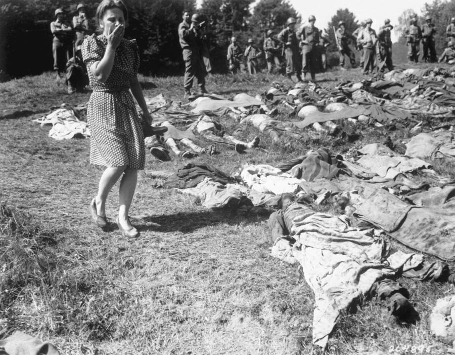 Woman Walking By Bodies WW2 Photos