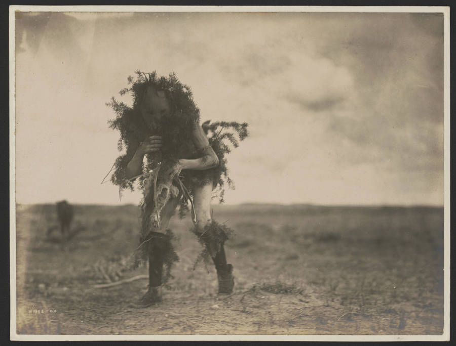Man Walking In Mask