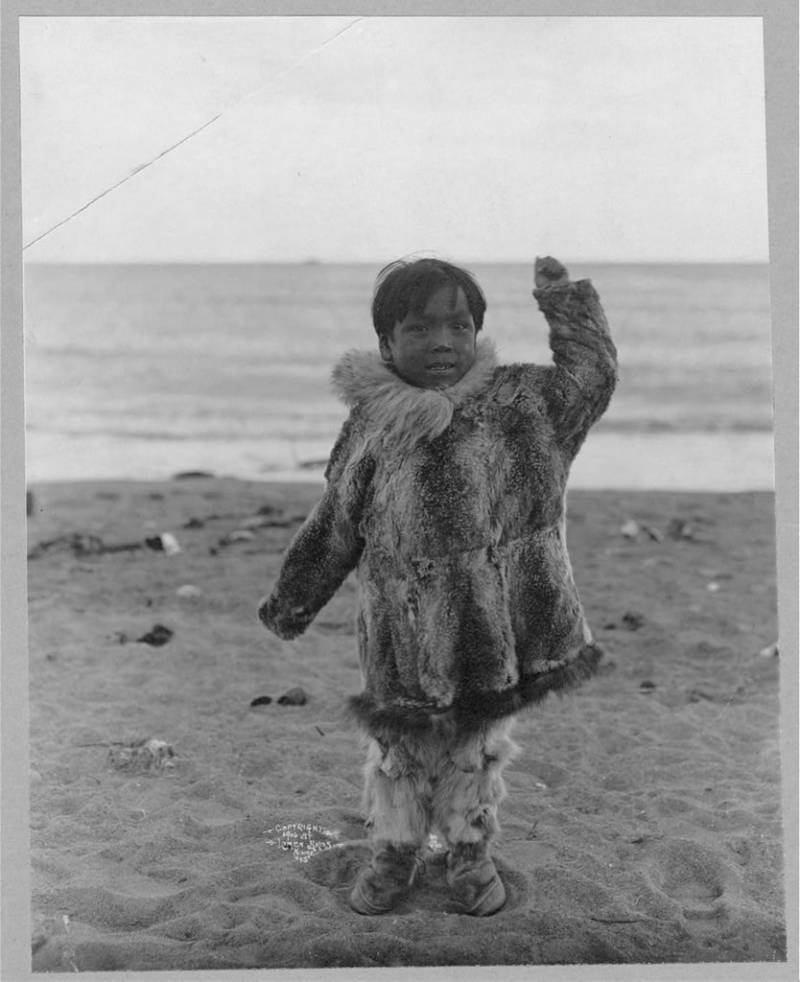 Eskimo Boy On Beach