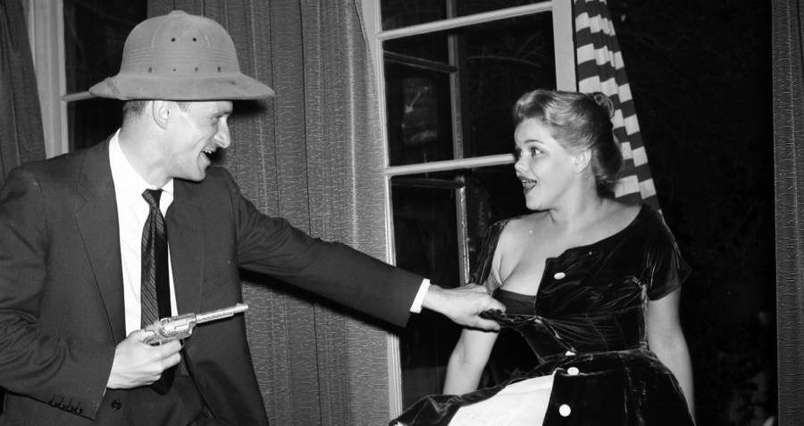 Hefner Holding Gun