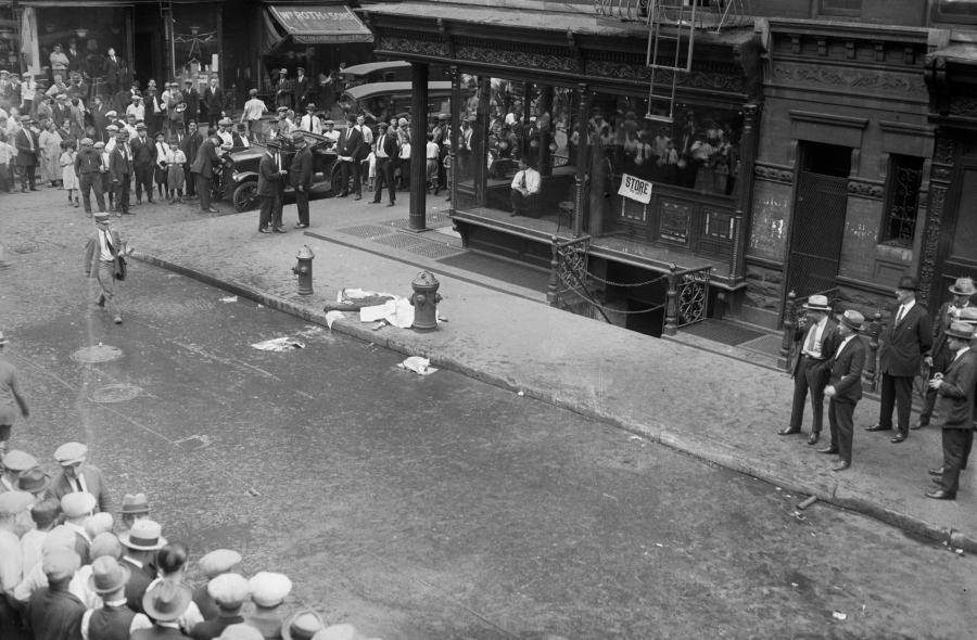 Victim Lying In Street Citizens Nearby