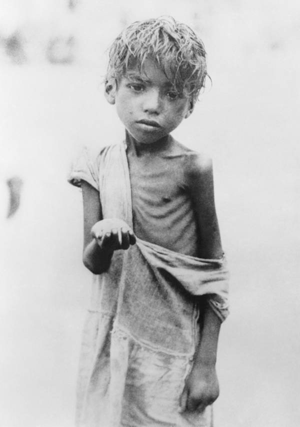 Starving Bengali child with an outstretched hand