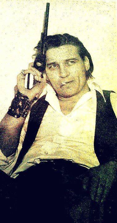 Waylon Jennings with a gun