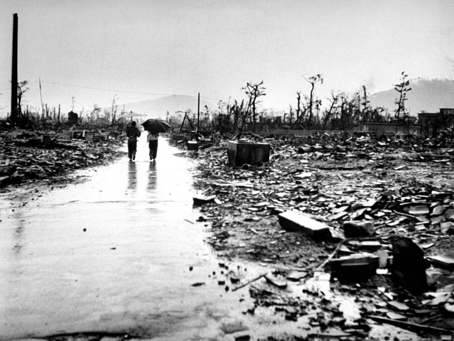 Two People Walk Through Devastated Hiroshima