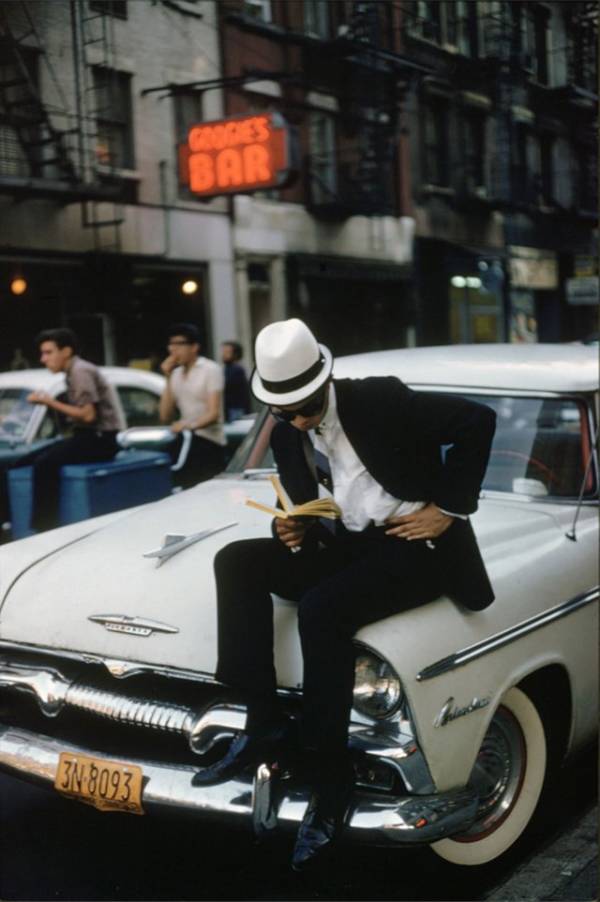 Man Reads On A Plymouth