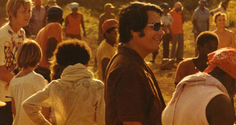 Jim Jones Smiling With Followers Featured