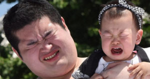 Sumo Wrestler And Baby Both Cry
