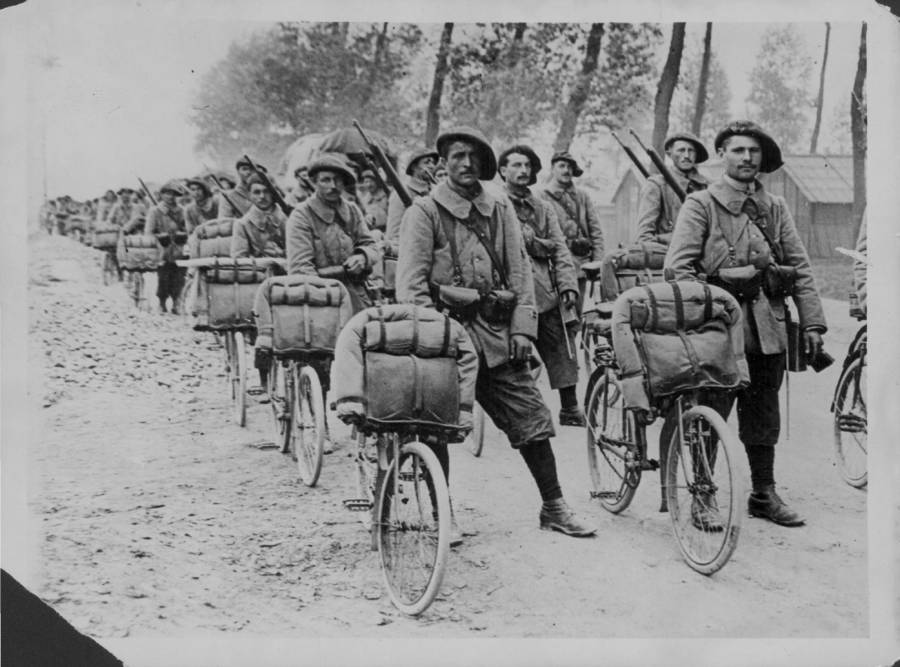 World War I Soldiers Stand With Bikes
