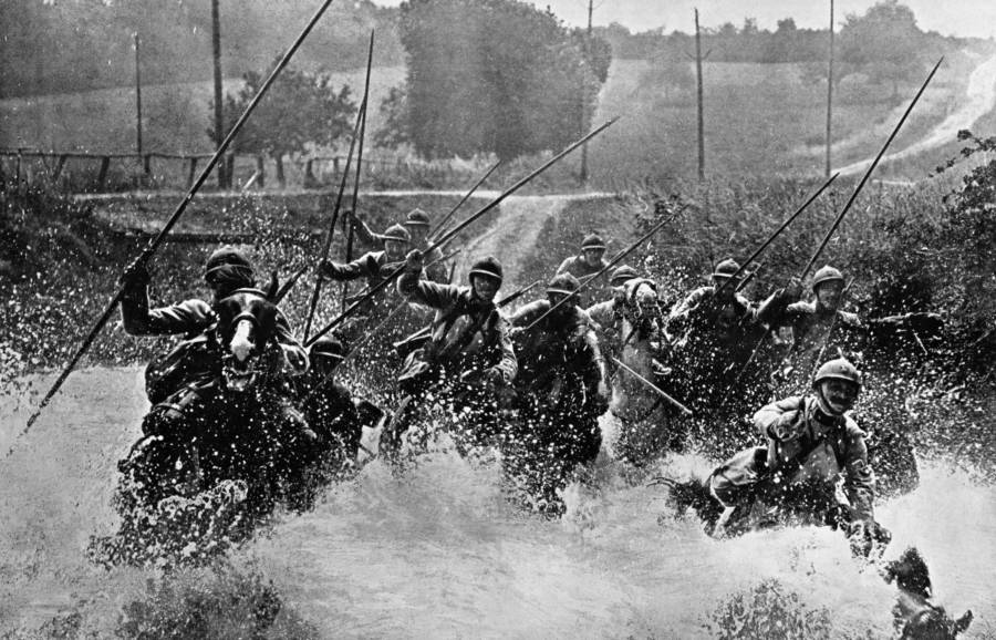 Soldiers Gallop On Horseback