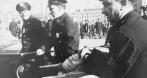 Malcolm X Being Carried On A Stretcher
