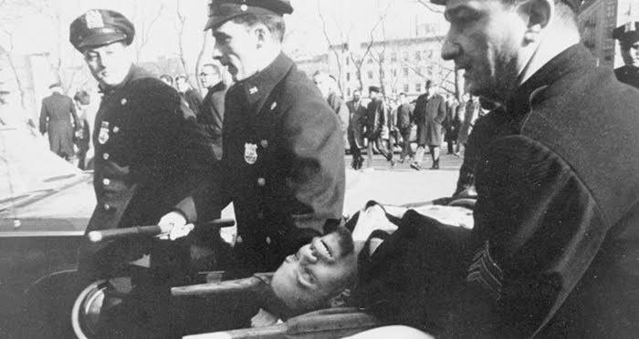 Malcolm X Being Carried On A Stretcher