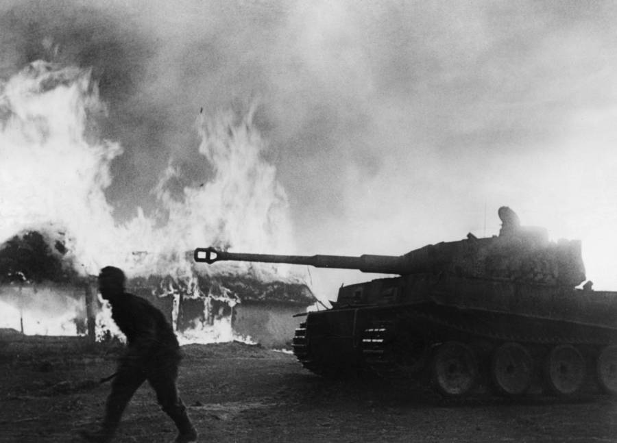 Building Erupts In Fire From Tank Attack