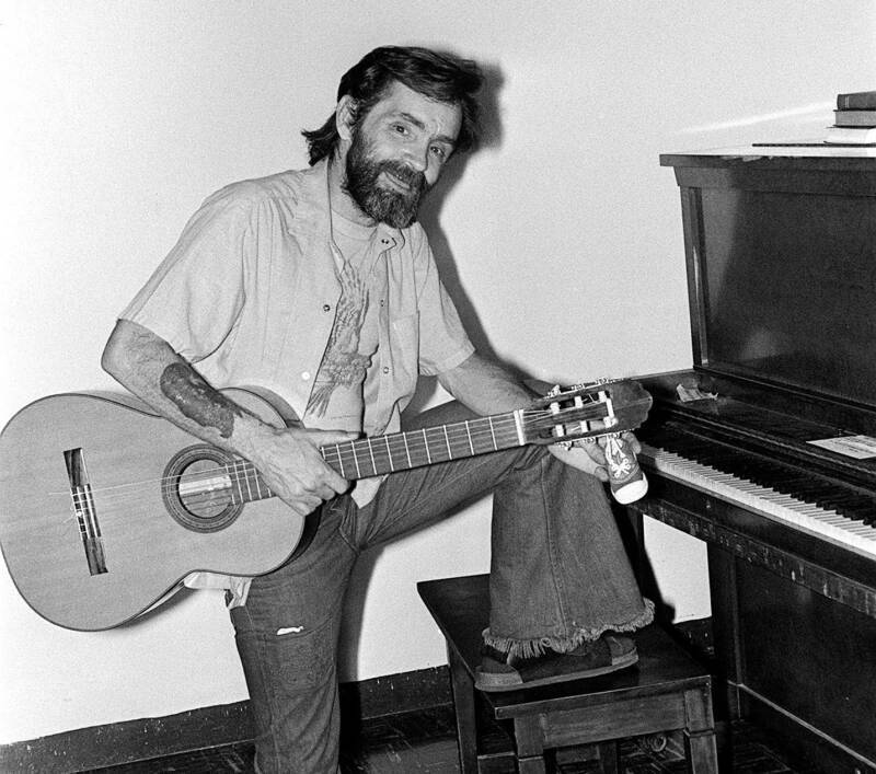 Charles Manson Playing Guitar