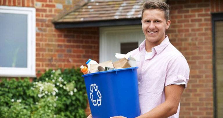 Man Holding Recycling Bin