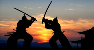 Sillhouettes Of Samurai Fighting Featured