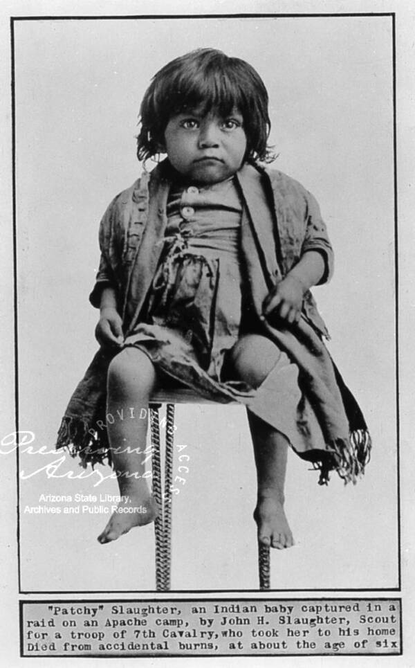 Apache Child Seated For A Portrait