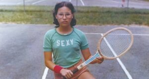 Girl Holding A Tennis Racket
