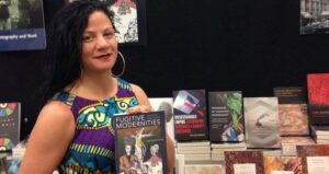 Jessica Krug Holding Her Book