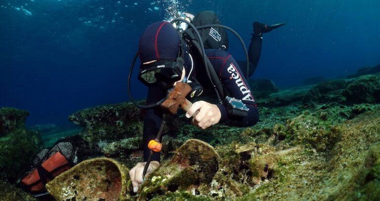 Greek Diver And Ancient Shipwreck