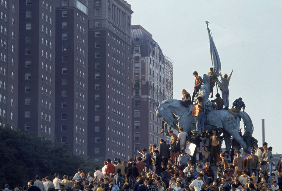 Demonstrators On Statue In Grant Park