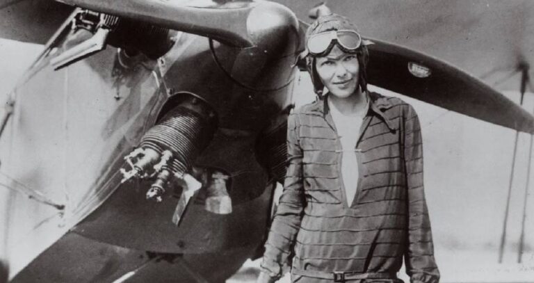 Amelia Earhart In Front Of Plane