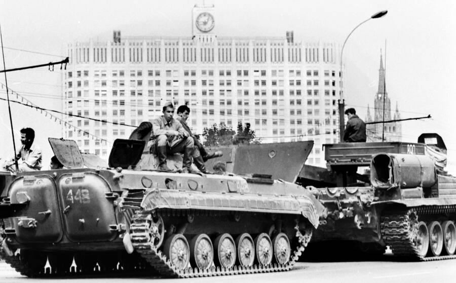 Soldiers Sitting On Tank