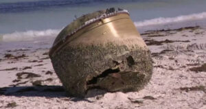 Green Head Object On Beach