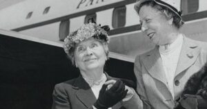 Helen Keller Standing In Front Of Plane