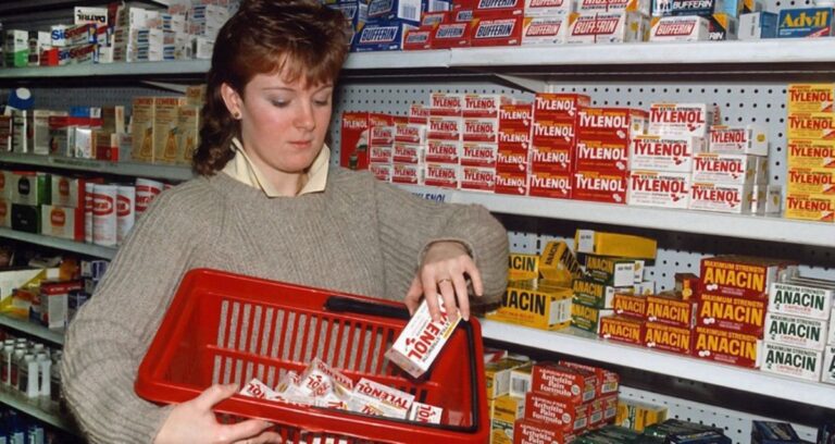 Woman Removing Tylenol From Shelf Featured