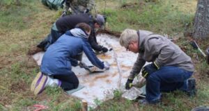 Archaeologists At Prehistoric Cemetery Featured