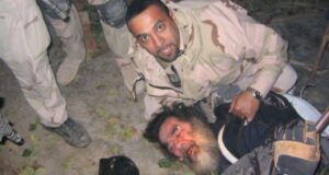 Soldier Capturing Saddam Hussein Featured
